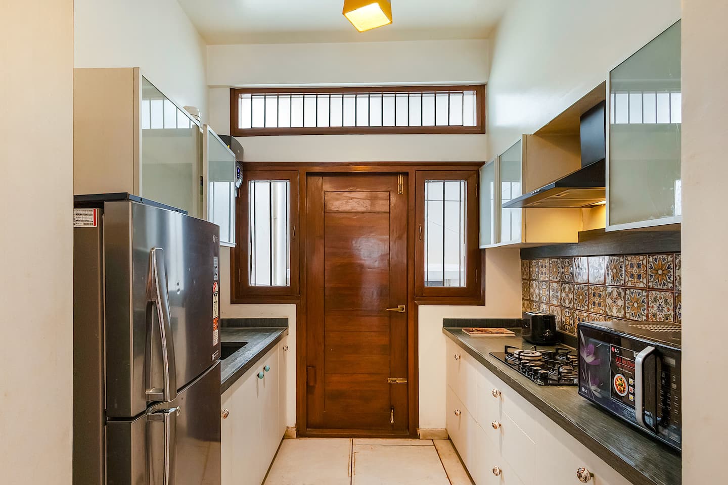 Earthy Bohemian Apartment with Bas-Relief Murals, HRBR Layout — Kitchen & Dining