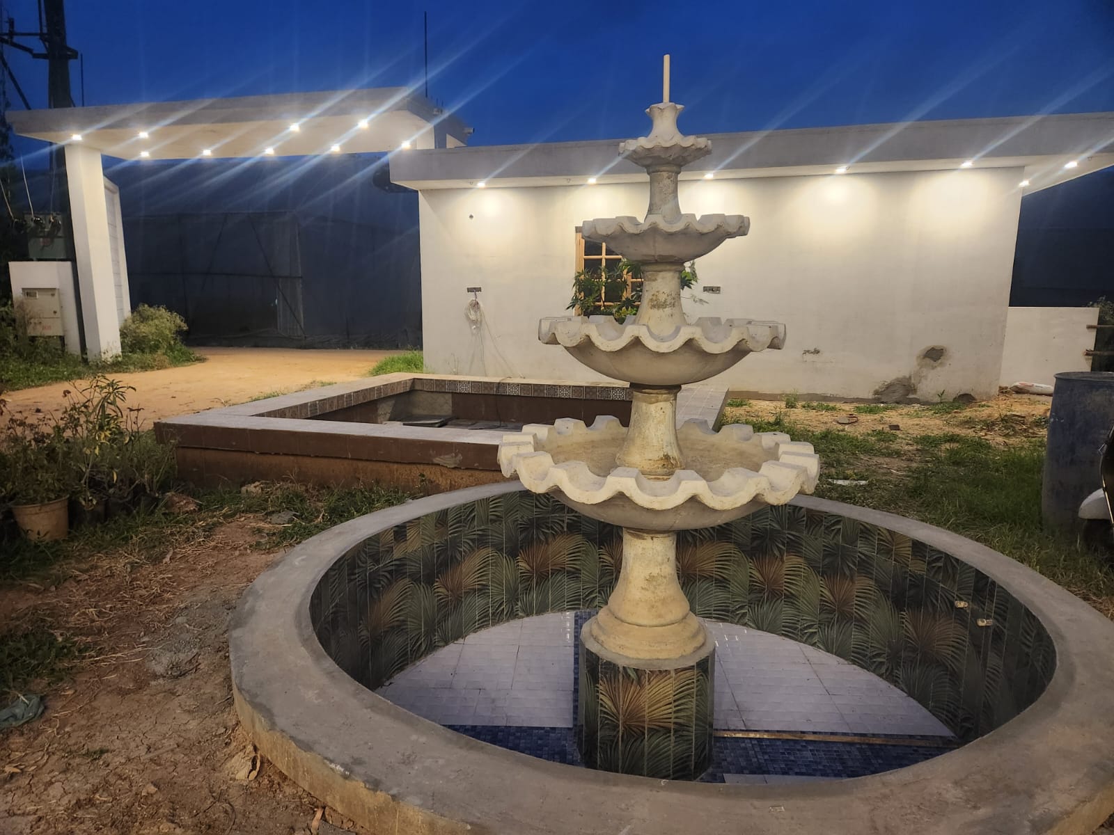 Vill Resort — Grand Halls, Pool & Lush Grounds ( 5 ) — Tiered Marble Fountain Courtyard